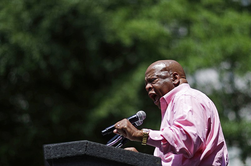 The "Good Trouble" rally is intended to honor the memory of U.S. Rep. John Lewis, D-Ga., seen here addressing a rally protesting the National Rifle Association's annual convention a few blocks away in Atlanta, Saturday, April 29, 2017. (AP Photo/David Goldman)