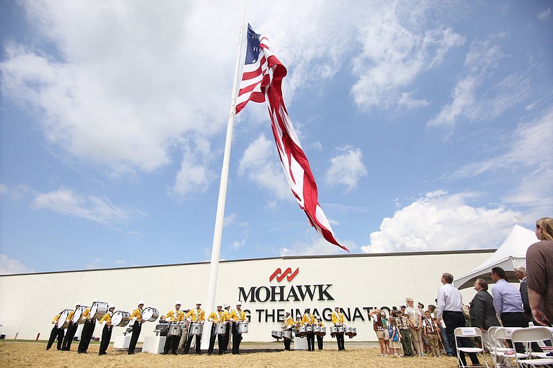 Staff photo by Erin O. Smith / The largest American flag in Georgia is raised at Mohawk Industries. Mohawk is one of the biggest U.S. producers of luxury vinyl tile and has supported the 25% tariffs on China-made LVT products which were restored this week by the United States.