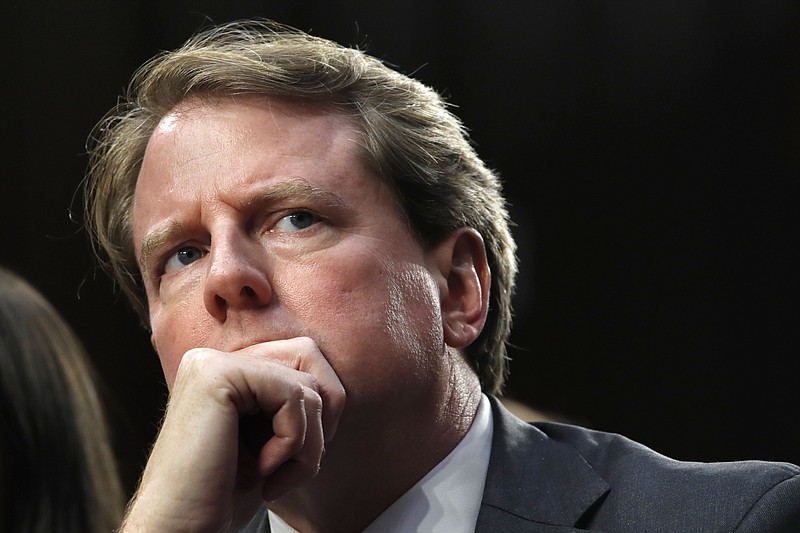 FILE - In this Sept. 4, 2018 file photo, White House counsel Don McGahn, listens as he attends a confirmation hearing for Supreme Court nominee Brett Kavanaugh before the Senate Judiciary Committee on Capitol Hill in Washington. A federal appeals court in Washington has revived House Democrats’ lawsuit to force former White House counsel Don McGahn to appear before a congressional committee. But the court's action Friday left other legal issues unresolved with time growing short in the current Congress.  (AP Photo/Jacquelyn Martin)