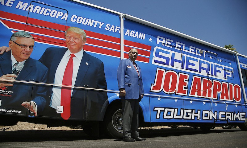 Former Maricopa County Sheriff Joe Arpaio, poses for a photograph in front of his campaign vehicle as he is running for the position of Maricopa County Sheriff again, Wednesday, July 22, 2020, in Fountain Hills, Ariz. Arpaio is trying to win back the sheriff's post in metro Phoenix that he held for 24 years. He faces his former second-in-command, Jerry Sheridan, in the Aug. 4 Republican primary in what has become his second comeback bid. (AP Photo/Ross D. Franklin)