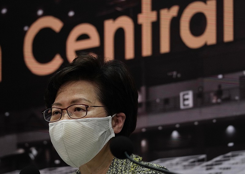 Hong Kong Chief Executive Carrie Lam listens to reporters' questions during a press conference in Hong Kong, Friday, Aug. 7, 2020. The semi-autonomous city of Hong Kong reports 95 new cases and three additional fatalities reported. The city of 7.5 million people has restricted indoor dining and require faces masks to be worn in all public places. (AP Photo/Vincent Yu)