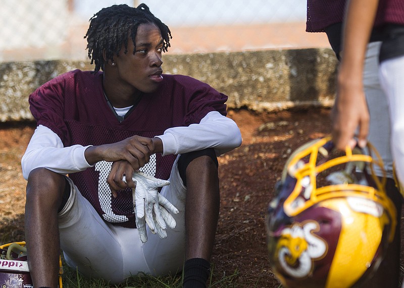 Staff photo by Troy Stolt / A Tyner Academy football player takes a break during practice last Monday, the first day TSSAA teams could hold full-contact practices in the 2020 preseason.