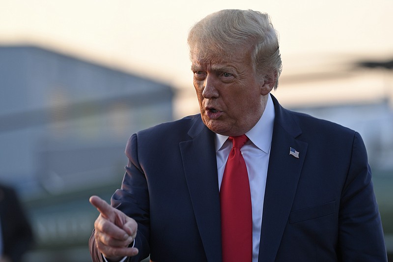 President Donald Trump talks with reporters before departing from Morristown Municipal Airport in Morristown, N.J., Sunday, Aug. 9, 2020. Trump was returning to Washington after spending the weekend at Trump National Golf Club. (AP Photo/Susan Walsh)