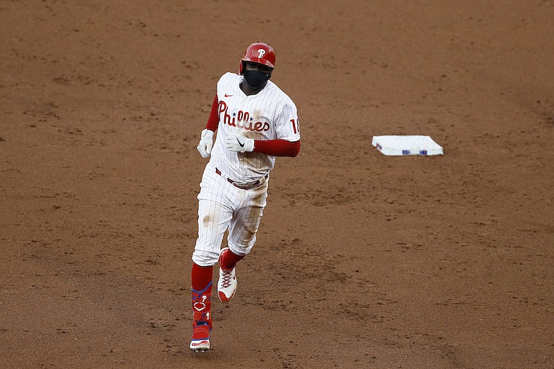 AP photo by Matt Slocum / The Philadelphia Phillies' Didi Gregorius rounds the bases after hitting a grand slam off the Atlanta Braves' Robbie Erlin during the second inning of Monday night's game in Philadelphia.