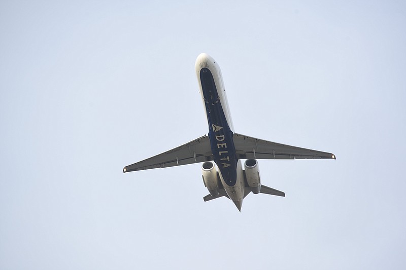 Staff photo by Tim Barber/ A Delta Airlines jet departs CHA at 15:28 hours Thursday over afternoon Lee Highway traffic.