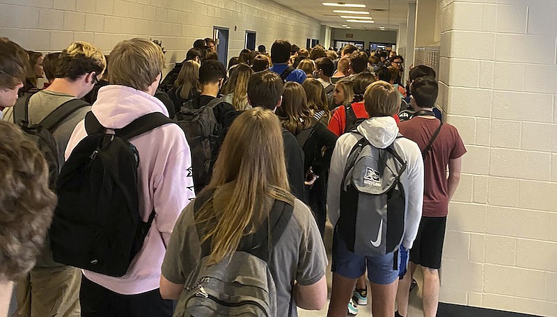 In this photo posted on Twitter, students crowd a hallway, Tuesday, Aug. 4, 2020, at North Paulding High School in Dallas, Ga. The Georgia high school student says she has been suspended for five days because of photos of crowded conditions that she provided to The Associated Press and other news organizations. Hannah Watters, a 15-year-old sophomore at North Paulding High School, says she and her family view the suspension as overly harsh and are appealing it. (Twitter via AP, File)