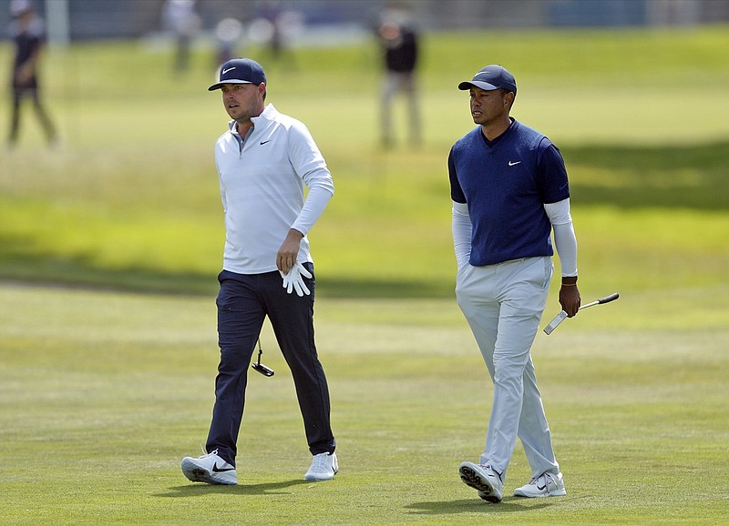 Photo courtesy of the San Francisco Chronicle / Keith Mitchell and Tiger Woods walk up the ninth fairway during the third round of the PGA Championship at TPC Harding Park on Saturday in San Francisco.