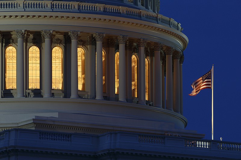 An American flag flies on the Capitol Dome in Washington.