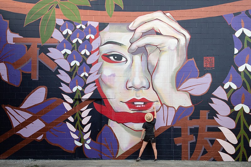 Contributed Photo by Odinn Media / Tokyo-born artist Juuri painted the kabuki-style "Wisteria Maiden" on the back of Memories Antiques in downtown Tullahoma, Tennessee, as part of Walls for Women. The mural honors the Japanese prisoners held at nearby Camp Forrest in World War II.