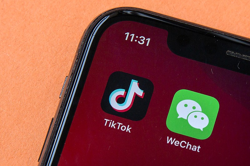 Icons for the smartphone apps TikTok and WeChat are seen on a screen in Beijing on Aug. 7.