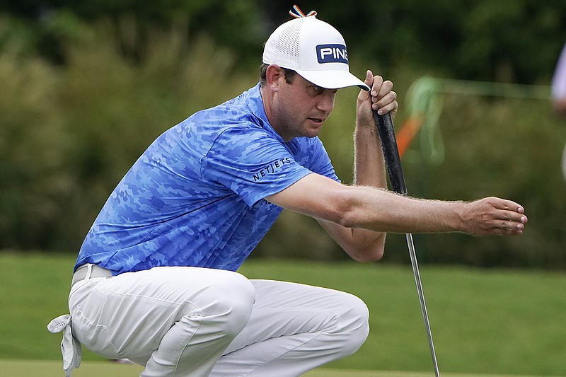 AP photo by Chris Carlson / Harris English lines up his putt on the 18th green at Sedgefield Country Club during the first round of the PGA Tour's Wyndham Championship on Thursday in Greensboro, N.C.