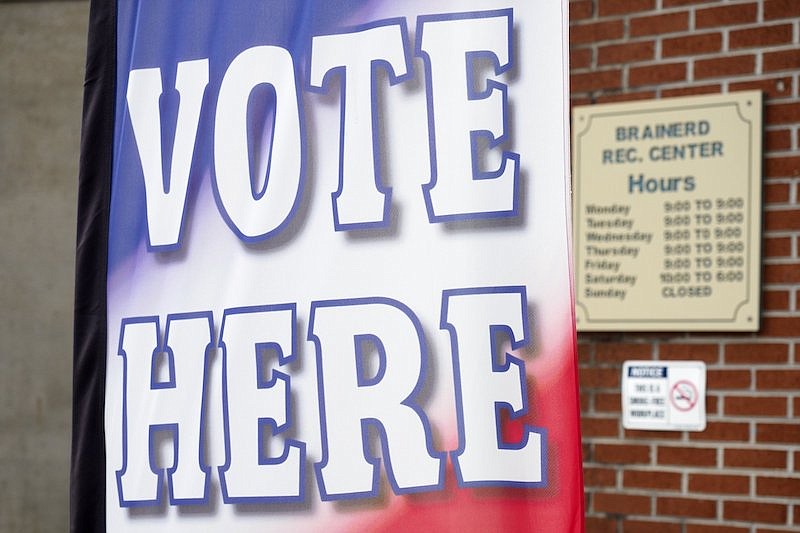 Staff photo by C.B. Schmelter / A "vote here" sign is seen at the Brainerd Youth and Family Development Center on Saturday, Aug. 1, 2020 in Chattanooga, Tenn. Saturday marked the end of the early voting period.