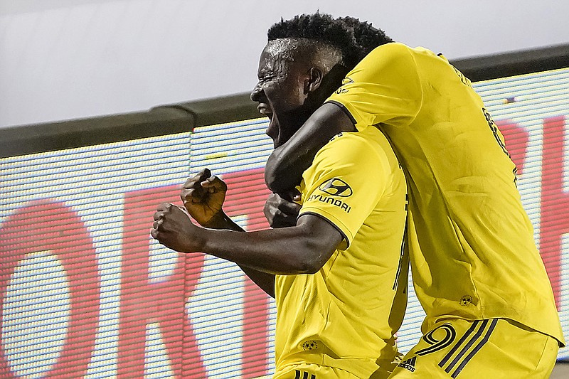 AP photo by Smiley N. Pool / Nashville SC forward David Accam, left, celebrates with forward Dominique Badji after scoring during the 86th minute of Wednesday's win over FC Dallas in Frisco, Texas. Accam's goal held up in a 1-0 win that was the first victory in franchise history.