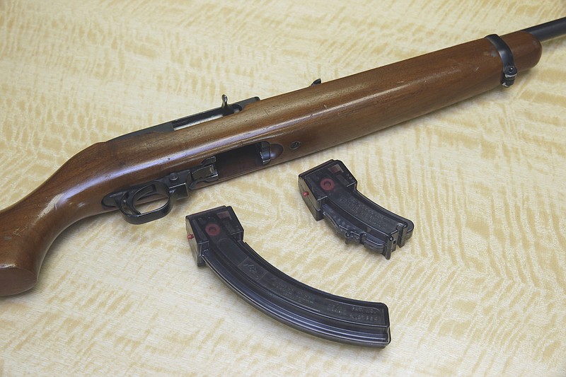 In this June 27, 2017, file photo, a semi-automatic rifle is displayed with a 25 shot magazine, left, and a 10 shot magazine, right, at a gun store in Elk Grove, Calif. A three-judge panel of the 9th U.S. Circuit Court of Appeals has thrown out California's ban on high-capacity ammunition magazines. The panel's majority ruled Friday, Aug. 14, 2020, that the law banning magazines holding more than 10 bullets violates the constitutional right to bear firearms. (AP Photo/Rich Pedroncelli, File)