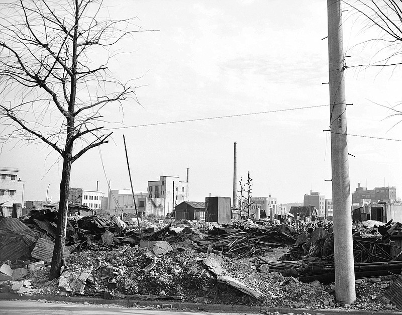 FILE - This Sept. 1, 1945, file photo shows destroyed business buildings in the city of Yokohama, near Tokyo. U.S. B-29's bombing raids left ruins debris and destruction near the American Consulate. The bombs stopped falling 75 years ago, but it is entirely possible - crucial even, some argue - to view the region's world-beating economies, its massive cultural and political reach and its bitter trade, territory and history disputes all through a single prism: Japan's aggression in the Pacific during World War II. (AP Photo/Frank Filan, Pool, File)

