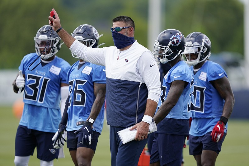 AP file photo by Mark Humphrey / Tennessee Titans coach Mike Vrabel is having to deal with the NFL's first COVID-19 outbreak.