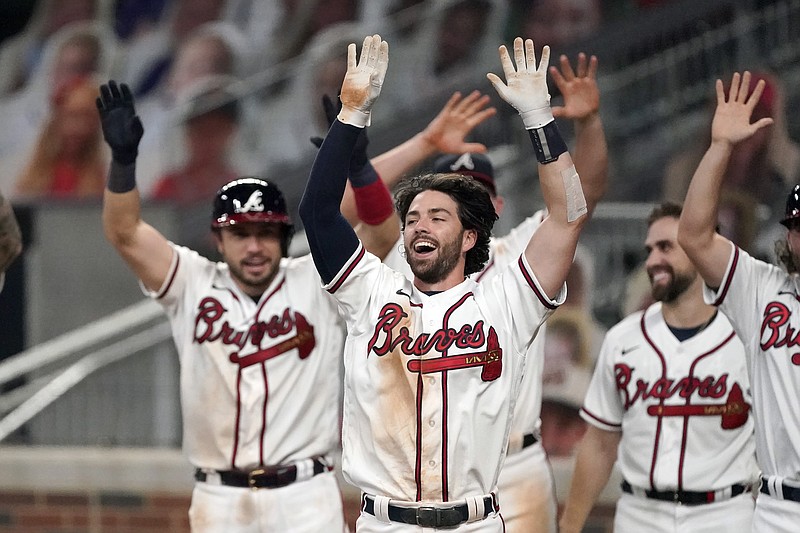 AP photo by John Bazemore / Atlanta Braves shortstop Dansby Swanson, center, celebrates after hitting a walk-off two-run homer in the ninth inning of Monday night's home game against the Washington Nationals.