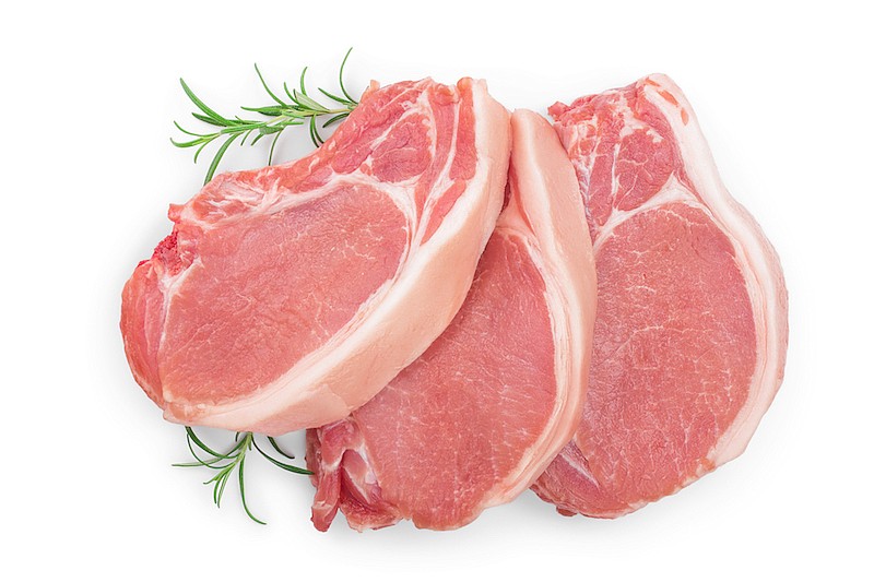 Sliced raw pork meat with rosemary isolated on white background. / Photo credit: Getty Images/iStock/kolesnikovserg