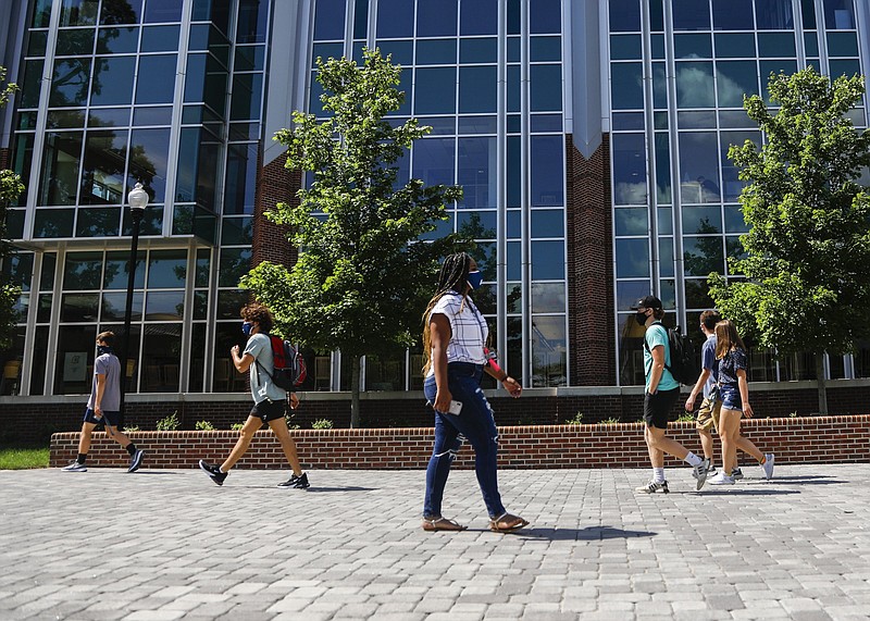 Staff photo by Troy Stolt / Students wear masks as they walk through the University of Tennessee at Chattanooga on Aug. 17, 2020.