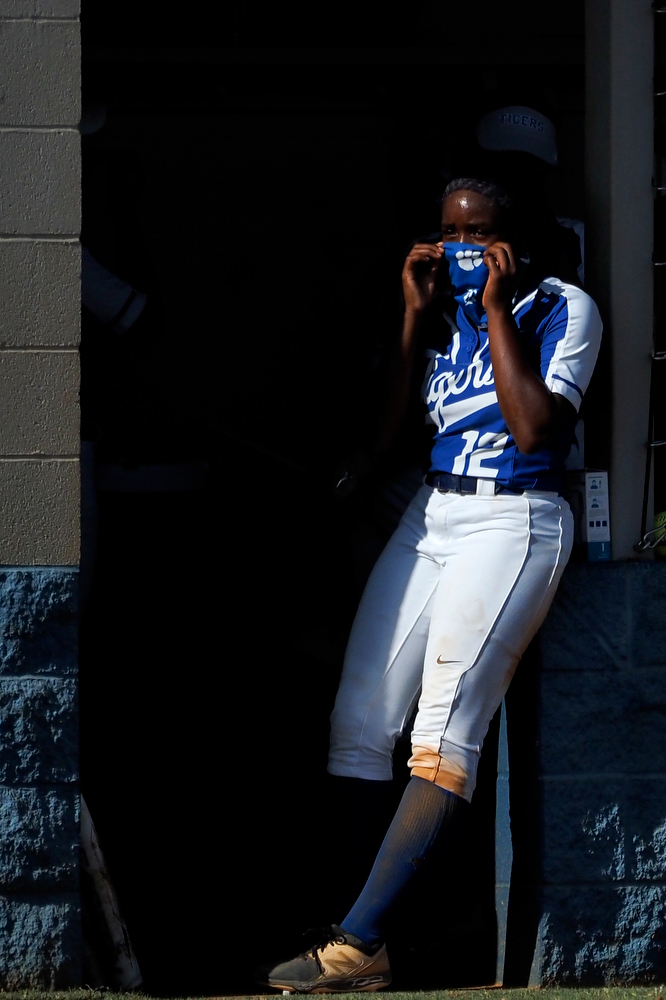 Staff photo by C.B. Schmelter / Ringgold's Amber Gainer (12) adjusts her mask in the dugout during their game against Coahulla Creek at Ringgold High School's Hazel Brown Field on Tuesday, Aug. 18, 2020 in Ringgold, Ga.