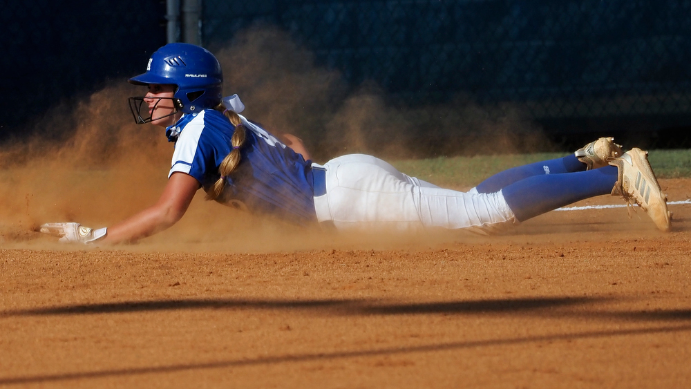 Staff photo by C.B. Schmelter / Ringgold's Addi Broome (4) slides into third against Coahulla Creek at Ringgold High School's Hazel Brown Field on Tuesday, Aug. 18, 2020 in Ringgold, Ga.