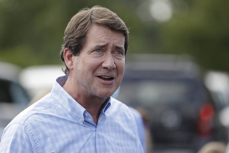 Former U.S. Ambassador to Japan Bill Hagerty speaks at a polling place Thursday, Aug. 6, 2020, in Brentwood, Tenn. Hagerty and Dr. Manny Sethi are competing to become the GOP nominee in the race to replace retiring Republican Sen. Lamar Alexander. (AP Photo/Mark Humphrey)