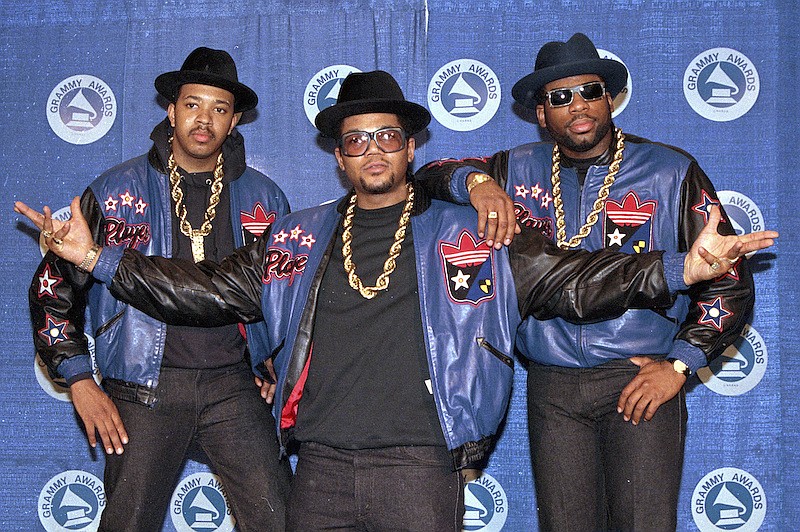 The rap group Run-DMC, from left, Joseph "Run" Simmons, Darryl "DMC" McDaniels, and Jason Mizell "Jam Master Jay," poses at the 31st annual Grammy Awards in New York, on March 2, 1988. Two suspects have been indicted in the 2002 killing of hip hop artist Jam Master Jay, which until now had been one of New York City's most notorious unsolved killings, according to two law enforcement officials, Monday, Oct. 17, 2020. (AP Photo/Mark Lennihan, File)