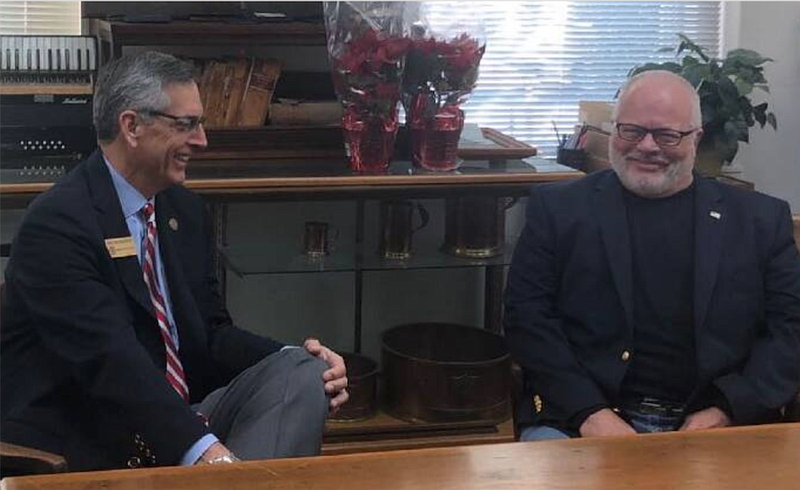 Photo by Patrick Filbin / Chattooga County Probate Judge Jon Payne, right, meets with Secretary of State Brad Raffensberger, in Summerville in December. Payne died Tuesday morning.