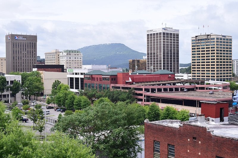 Lookout Mountain serves as the backdrop for this view of downtown Chattanooga from the Unum parking garage. Major landmarks are, from left, First Horizon Bank, the James Building, the Maclellan Building, Regions Bank, Market Court (home to Raymond James and Fletcher Bright), The Westin, Republic Centre and the Liberty Tower. / Staff Photo by Robin Rudd