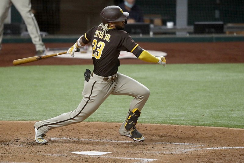 San Diego Padres' Fernando Tatis Jr. follows through on a fielders choice in the second inning of a baseball game against the Texas Rangers in Arlington, Texas, Monday Aug. 17, 2020. The Padres' Trent Grisham was out at second on the play. (AP Photo/Tony Gutierrez)