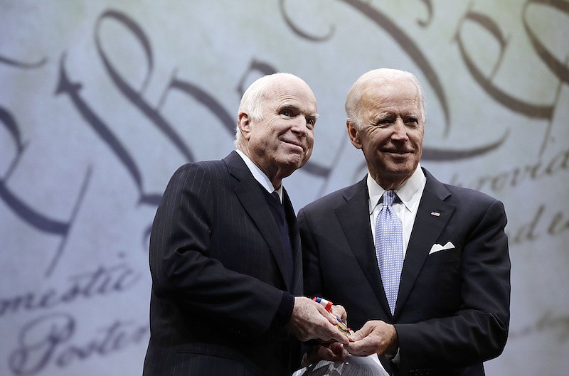 In this Oct. 16, 2017, file photo Sen. John McCain, R-Ariz., receives the Liberty Medal from Chair of the National Constitution Center's Board of Trustees, former Vice President Joe Biden, in Philadelphia. (AP Photo/Matt Rourke, File)