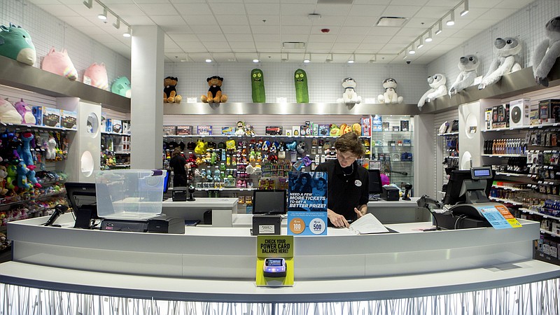 Staff file photo by C.B. Schmelter / Austin Bryant readies for the grand opening at the Dave & Buster's at Hamilton Place mall earlier this year. The entertainment venue is part of the revamp of the former Sears space at the mall.