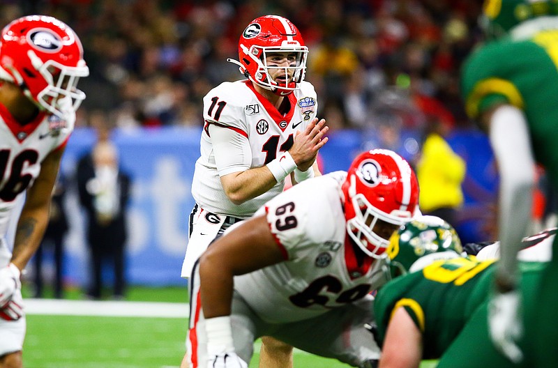 Georgia photo by Tony Walsh / Georgia offensive lineman Jamaree Salyer (69) started at right tackle during January's Sugar Bowl victory over Baylor, which marked the final college game for Bulldogs quarterback Jake Fromm (11). Salyer may be the left tackle this season.