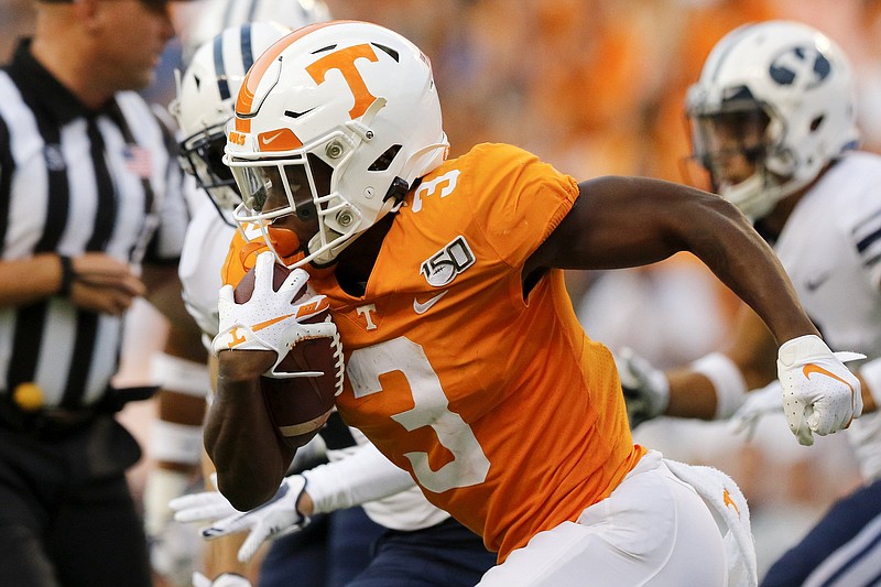 Staff photo by C.B. Schmelter / Tennessee running back Eric Gray looks for running room against BYU last September in Neyland Stadium.