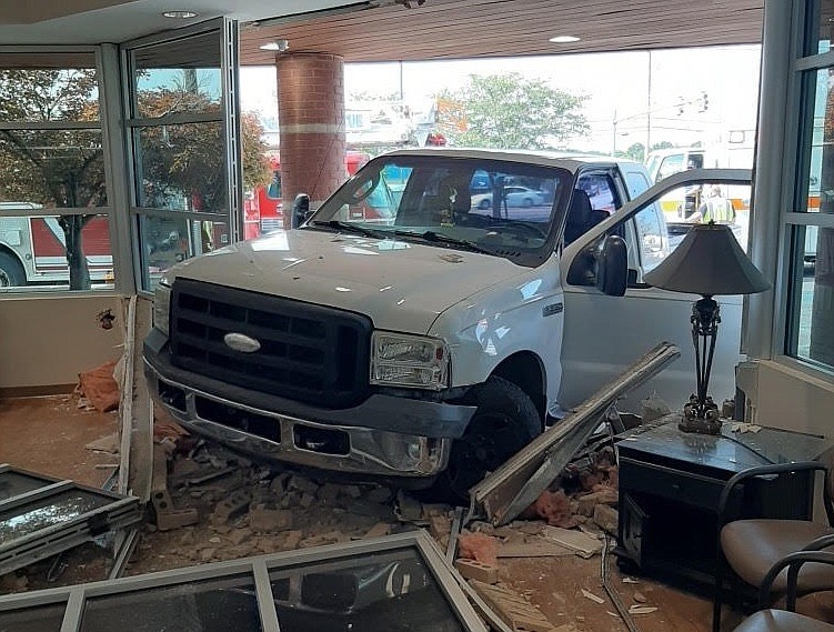 The driver of a truck was hospitalized with minor injuries after crashing into the Center for Oral Facial and Implants Surgery on Shallowford Road on Thursday, Aug. 20, 2020. / Photo contributed by the Chattanooga Fire Department	