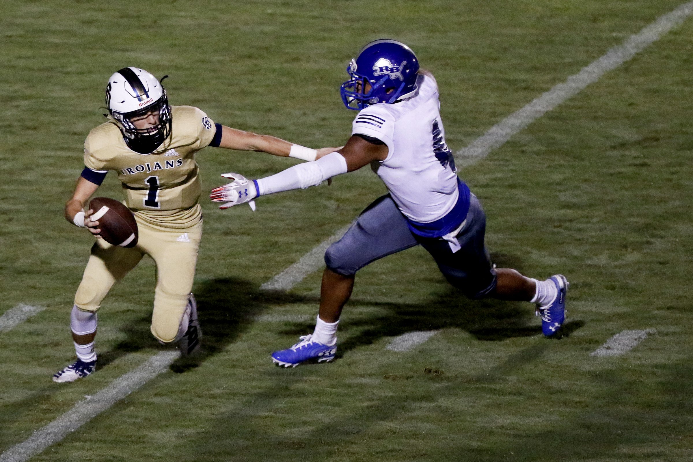 Staff photo by C.B. Schmelter/ Red Bank's Cam Bell (4) pressures Soddy-Daisy's Isaac Barnes (1) at Soddy-Daisy High School's Robert Talaska Field on Friday, Aug. 23, 2019 in Soddy-Daisy, Tenn.