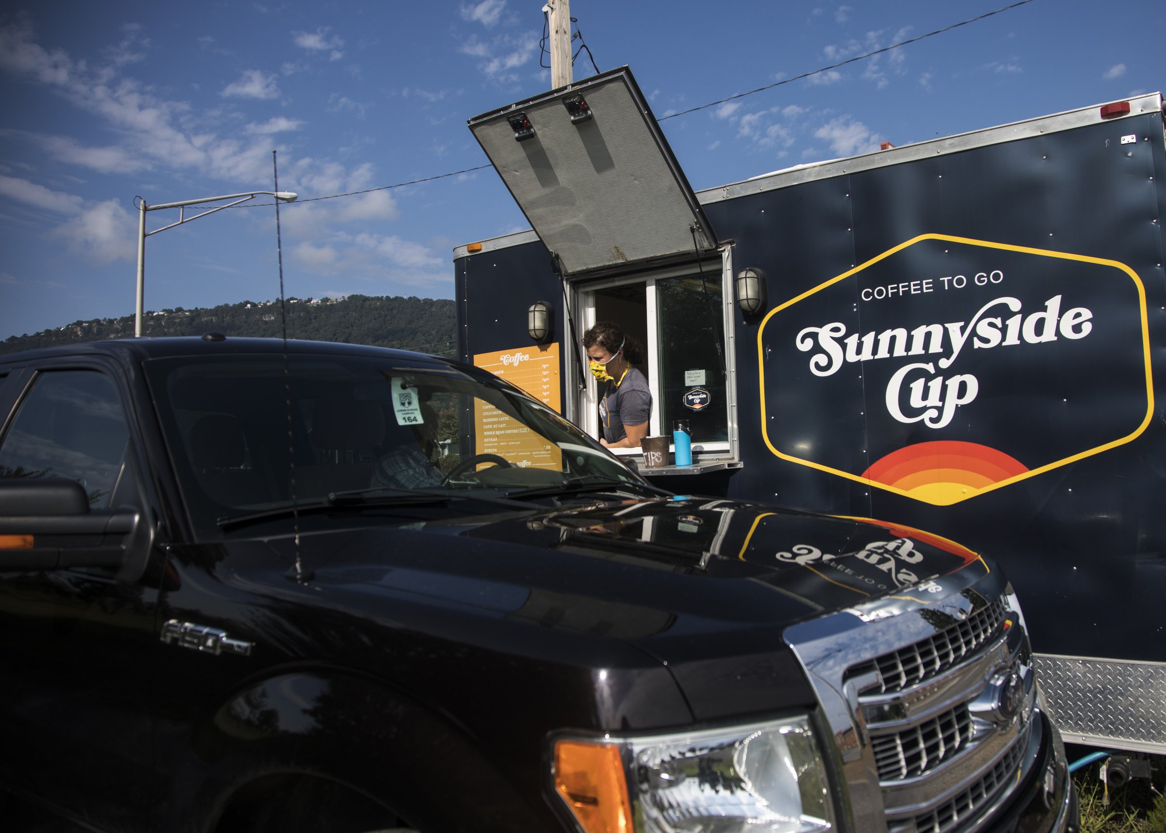 Staff photo by Troy Stolt / Melody Kobernik, owner of Sunnyside Cup, takes a customer's order at their 3008 South Broad St. location on Wednesday. The to-go coffee shop recently announced it will be opening a new location on Signal Mountain Road.