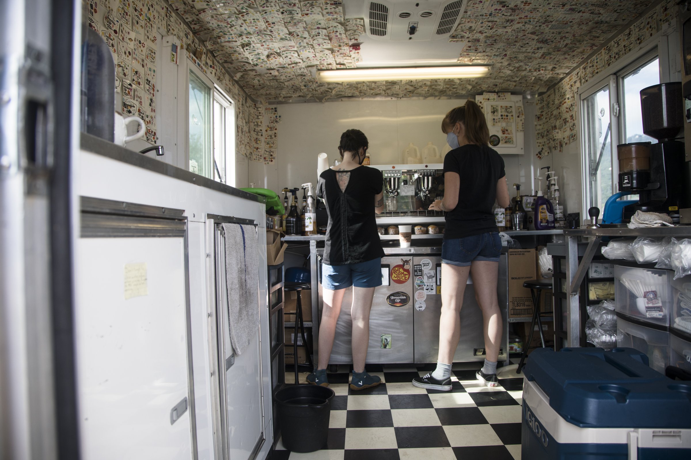 Staff photo by Troy Stolt / Baristas Kori Collins and Marah Bates prepare a latte at Sunnyside Cup's location at 3008 South Broad St. on Wednesday. The to-go coffee shop recently announced it will be opening a new location on Signal Mountain Road.