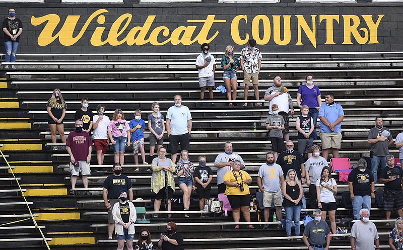 Staff photo by Robin Rudd / Hixson football fans stand for the national anthem before Friday's home game against Brainerd, the season opener for both teams.