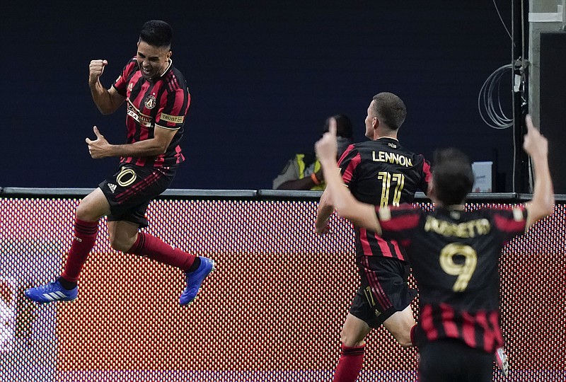 AP photo by Brynn Anderson / Atlanta United FC midfielder Pity Martinez, left, celebrates after scoring his first of two goals in Saturday night's home match against Nashville SC.