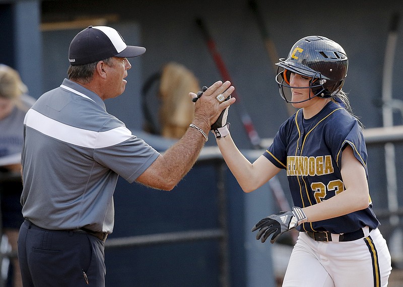 Staff photo / UTC softball coach Frank Reed congratulates Criket Blanco as she rounds third base after hitting a three-run homer against Tennessee Tech on March 31, 2015, at Frost Stadium. Reed's staff entering the 2021 season, his 20th in charge of the Mocs, will include former University of Tennessee standout Cheyanne Tarango. She will work primarily with pitchers.