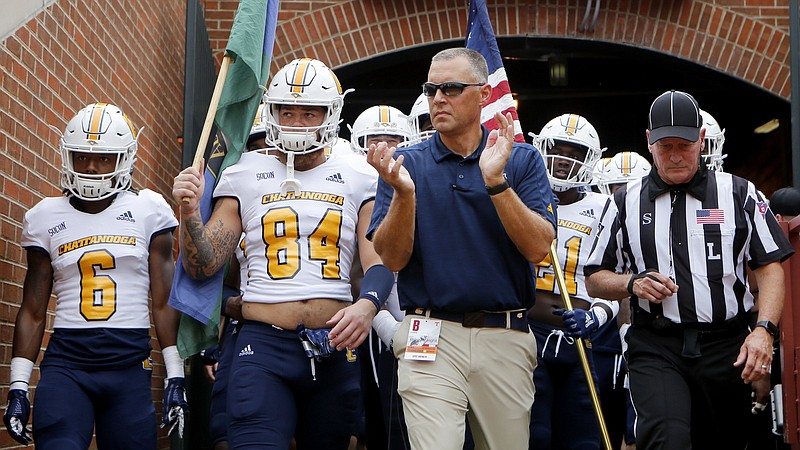 Staff photo by C.B. Schmelter / UTC head coach Rusty Wright and his team take the field for their NCAA football game against Tennessee at Neyland Stadium on Saturday, Sept. 14, 2019 in Knoxville, Tenn.