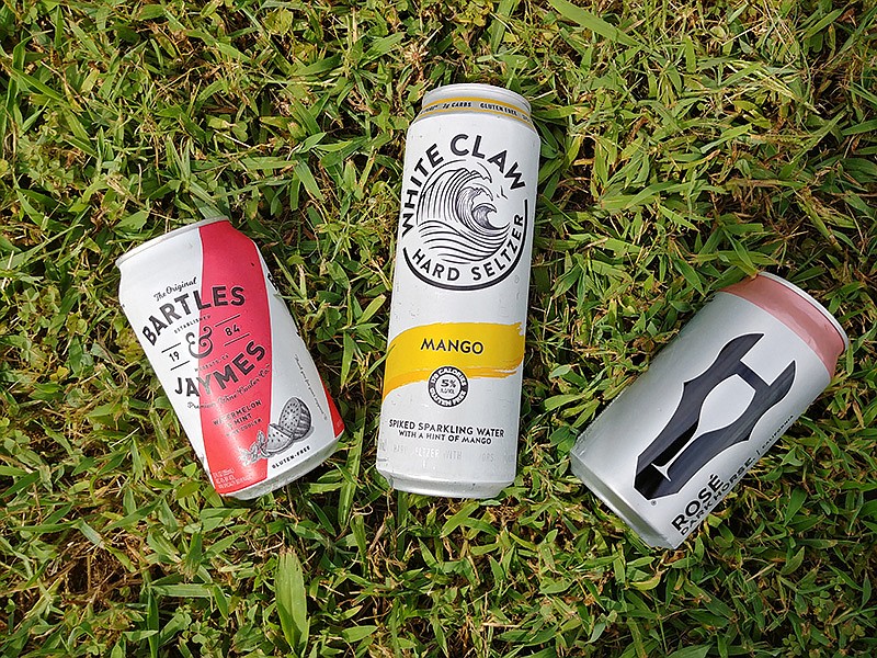 Cans of Bartles & Jaymes Watermelon & Mint, White Claw Hard Seltzer and Dark Horse Canned Rose / Staff Photo by Jennifer Bardoner