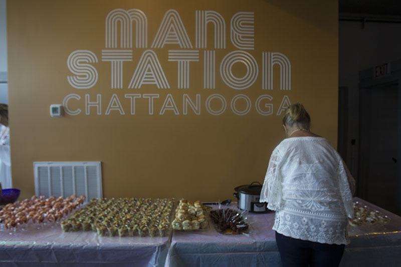 Staff photo by Troy Stolt / Finger foods and Champagne welcome guests.