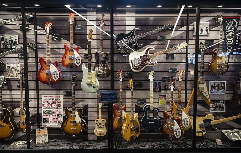 Staff photo by Doug Strickland / Guitars are on display on the opening day of the Songbirds Guitar Museum on Station Street on Saturday, March 11, 2017, in Chattanooga, Tenn. 