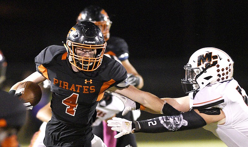 Staff photo by Robin Rudd / South Pittsburg's Hunter Frame (4) breaks free from a would-be tackler during a home game against Meigs County on Oct. 11, 2019.