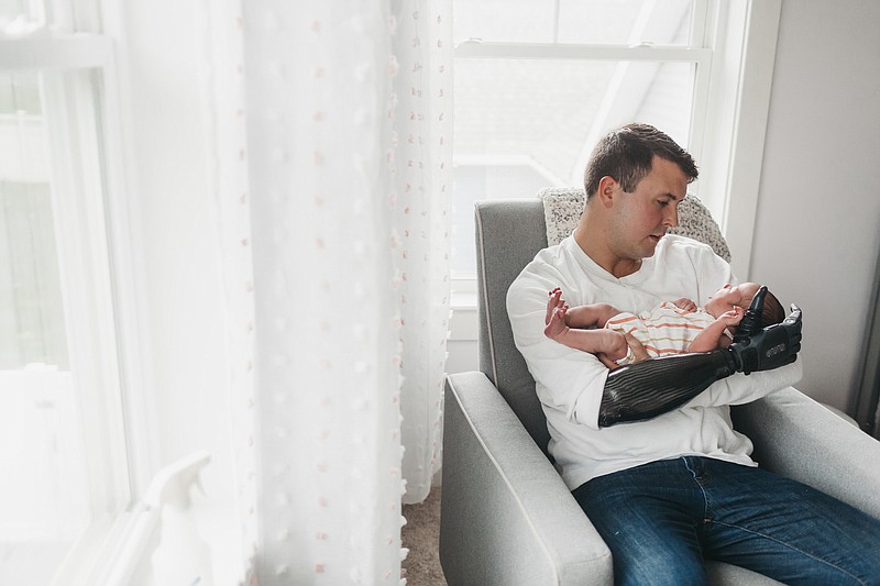 Photography contributed by Fillauer / Mackenzie Hilsinger of Mechanicsburg, Pennsylvania, uses the TASKA hand to hold his newborn baby.