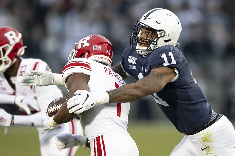 AP photo by Barry Reeger / Penn State linebacker Micah Parsons (11) tackles Rutgers tight end Johnathan Lewis on Nov. 30, 2019, in State College, Pa.