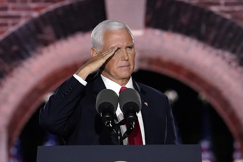 AP Photo, Andrew Harnik / Vice President Mike Pence salutes as he speaks Wednesday on the third day of the Republican National Convention at Fort McHenry National Monument and Historic Shrine in Baltimore.