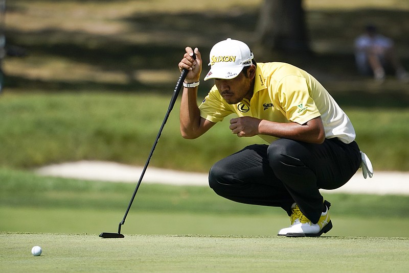 AP photo by Charles Rex Arbogast / Hideki Matsuyama lines up his putt on the 11th green at Olympia Fields County Club during the first round of the BMW Championship on Thursday in Illinois.